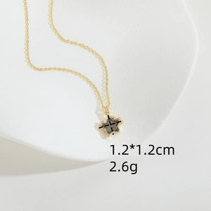 Star-shaped gold necklace with zircon stones and dark resin center pendant 1.2x1.2cm