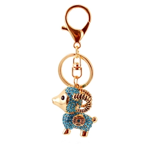Simpatico portachiavi a forma di capra dorata con strass blu e motivo a moneta