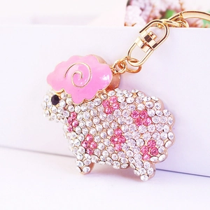 Sparkling crystal sheep keychain with pink goat horns and gold-tone metal clasp