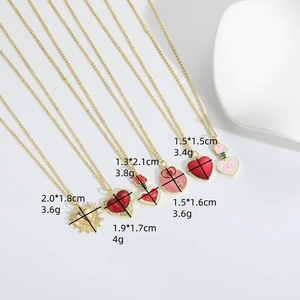 Set of six 14k gold heart pendant necklaces with red enamel and floral engravings