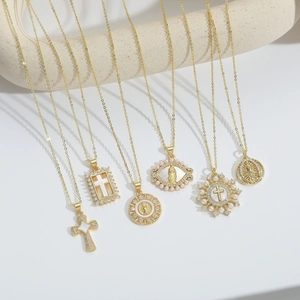 Detailed set of six gold-plated religious necklaces with cross and virgin mary pendants