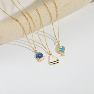 Vintage gold crystal ball necklace with snowflake and globe pendants on O-chain