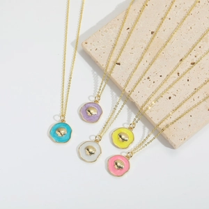 Vintage shell pendant necklace with gold round disc and 3D relief in five summer colors