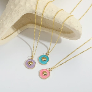 Vintage gold disc shell necklaces in purple, turquoise, and pink enamel for women