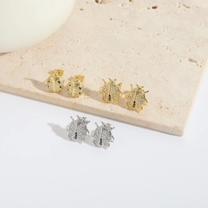 Exquisite ladybug stud earrings with zircon inlay in gold and silver metal finishes