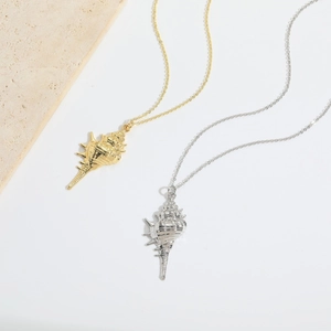 Luxurious gold and silver conch shell pendant necklaces with realistic spiral texture