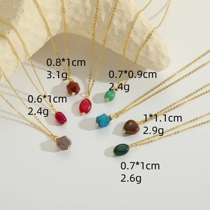 Selection of colorful natural stone heart and oval pendants on gold chains for women