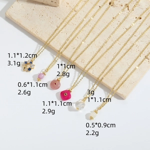 Gold necklaces set with natural stone and glass pendants in various shapes and sizes