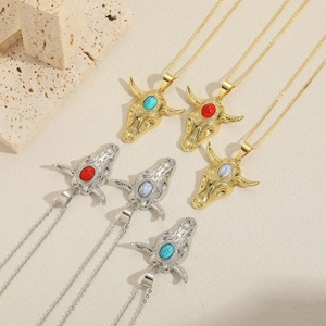 Vintage bohemian bull head pendant necklace with turquoise stone and warm metal tones
