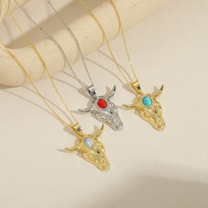 Vintage bull head pendant necklaces with turquoise and ruby stones in gold and silver