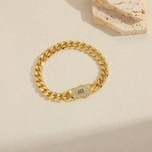 Bracelet maille cubaine doré 14k avec fermoir serti de zircons et logo S