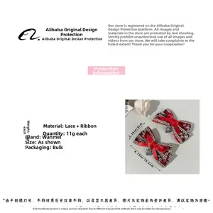 Detail showing red lace bow hair clips with heart charms and 10.5cm x 6cm dimensions