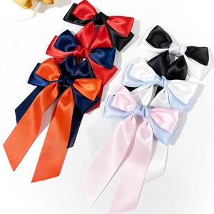 Set of colorful satin bow hair clips for women in elegant color-block designs