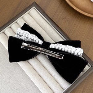 Elegant black velvet bow hair clip with white lace overlay and silver metal crocodile clip