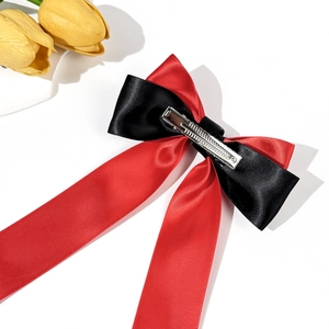 Elegant red and black ribbon bow hair clip in satin fabric for women hair styling