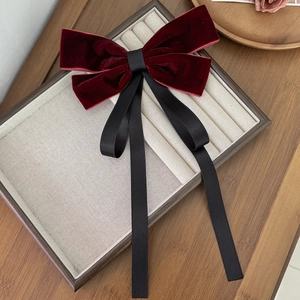 Elegant French velvet bow hair clip with long ribbons in burgundy and black tones