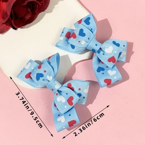 Detail view showing dimensions of light blue heart pattern bow hair clips set