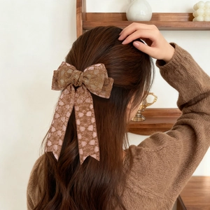 Elegant French lace bow hair clip with floral patterns and long ribbons for women