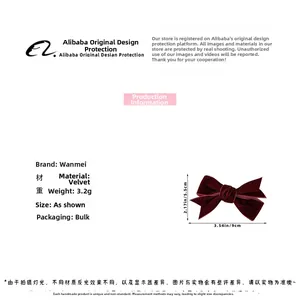 Deep red velvet bow hair clip showing dimensions of 9cm width and 5.5cm height