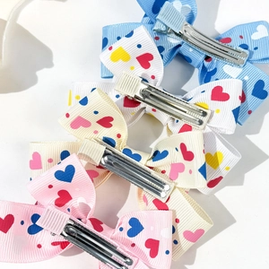 Colorful bow hair clip set with heart prints and metal duckbill clips for girls