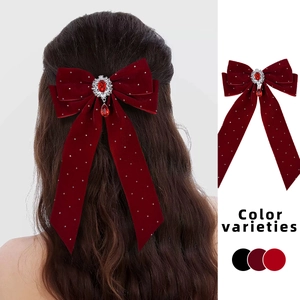 Elegant red velvet bow hair clip with ruby pendant and long ribbon for women
