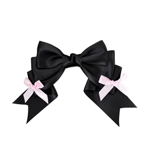 Lolita style black satin bow hair clip with pink mini bows on a white background