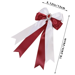 Detail of satin bow hair clip with gem pendant, measurements 13cm width and 26cm length