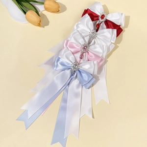 Elegant satin bow hair clips with gemstone pendants in multiple colors and long streamers