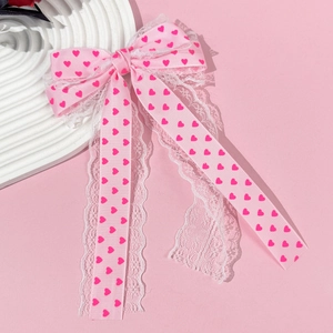 Pince à cheveux nœud rose à motifs cœurs avec dentelle blanche et rubans longs