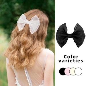 Elegante fermaglio per capelli con fiocco in organza nei colori nero, rosa e bianco