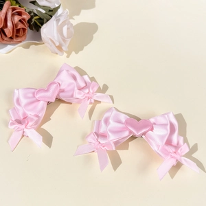 Pink satin bow hair clips with heart embroidery detail for sweet girl fashion