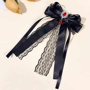 Lace bow hair clip with red gemstone pendant in elegant gothic lolita style detail