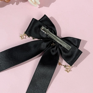 Elegant black satin bow hair clip with gold star chain tassels in Korean style