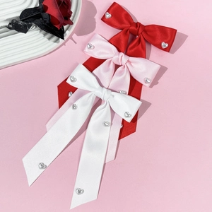 Elegant satin bow hair clips with pearls and heart charms in red, pink and white