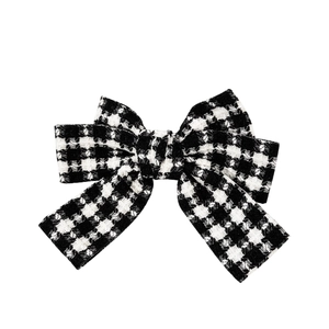 Classic black and white houndstooth bow hair clip in tweed fabric for women