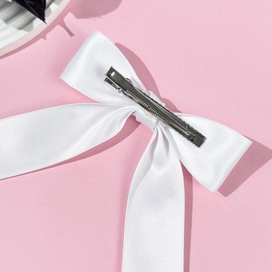 Elegant white satin ribbon bow hair clip with a silver metal duckbill clip for women