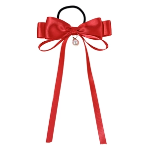 Elegant red satin bow hair tie with long ribbons and a delicate pearl pendant