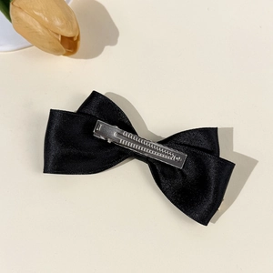 Elegant black satin bow hair clip with silver metal alligator grip for women