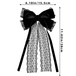 Detail of gothic black velvet bow hair clip with lace streamers showing 28cm length