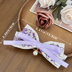 Detail of floral embroidery bow hair clip with pearl pendant and size dimensions