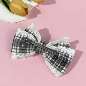 Retro plaid lace bow hair clip with sequins and metal duckbill clip on pink background