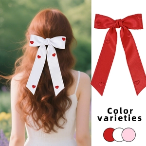 Elegant red heart bow hair clip with long ribbons for women, shown in multiple colors and styles