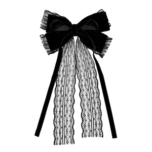 Gothic black velvet bow hair clip with lace fringe and ribbons on white background
