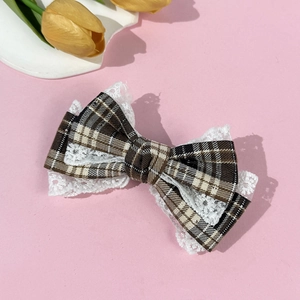 Vintage brown plaid hair clip with white lace bow and elegant tulip background