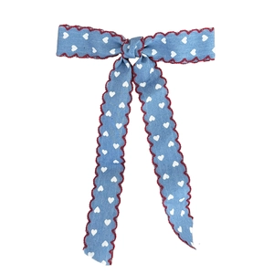 Blue denim style hair clip with white heart prints and red scalloped edges