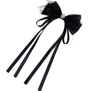 Elegant black bow hair clip with lace fringe and pearls in a French chic style