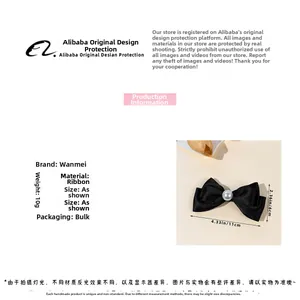 Détail de la pince à cheveux noeud noir avec perle, longueur 11cm, poids léger de 10g