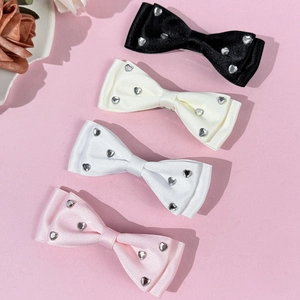 Set of 4 satin bow hair clips in black, beige, white, and pink with heart rhinestones
