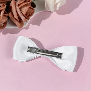 Elegant white satin bow hair clip with silver metal alligator grip for women and girls