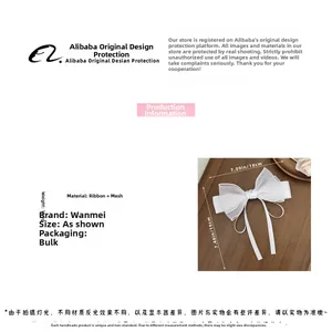 Detailed view of white mesh bow hair clip with ribbons measuring 18x19cm and weighing 11.9g